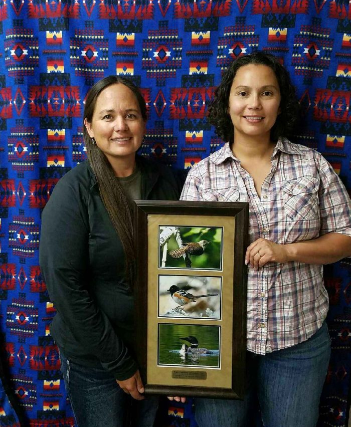 CSKT Wildlife Biologists Stephanie Gillin and Whisper Camel-Means receving a Montana Audubon Award for Environmental Education